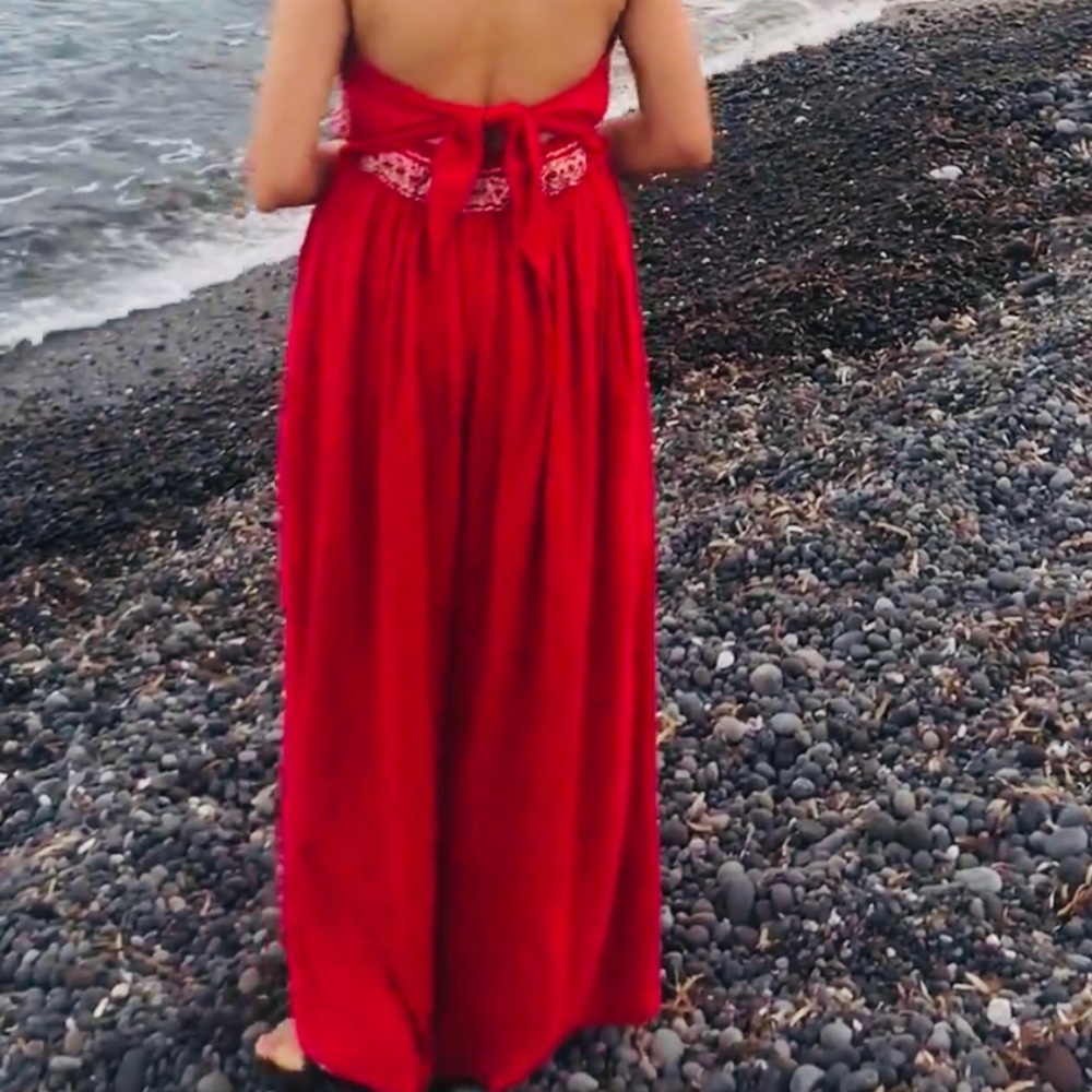 This beautiful red jumpsuit is great for summer.  Fabric is 100% cotton.